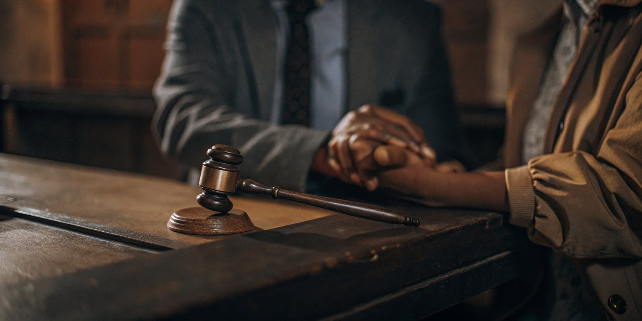 A compassionate attorney reassuring a relieved client after an accident